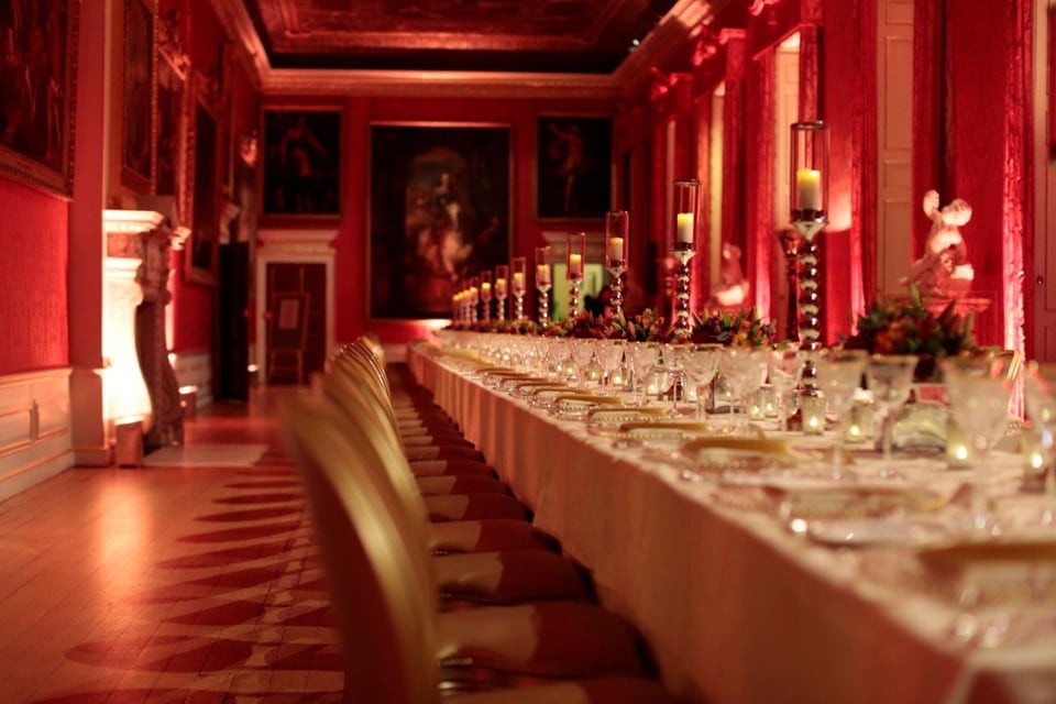 Place settings down a long candlelit table in the King's Gallery at Kensington Palace.